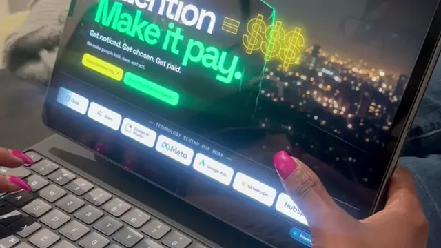A person using the Attention Lasso website on a tablet